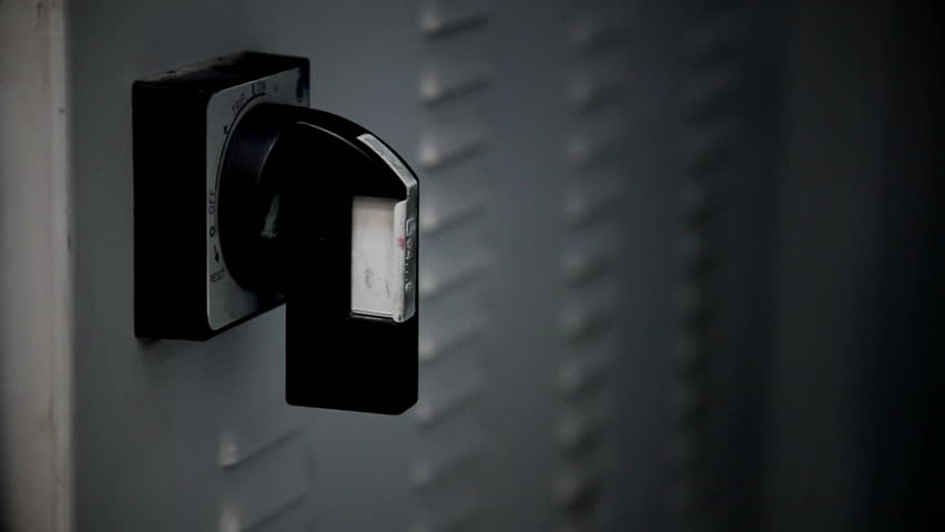 Close up of male hand turning on the switch