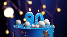 90th Birthday Cake with Blue Number 90 Candle – Slow Motion Blow Out on Starry Sky and Moon Background, Close-Up View - Powered by Shutterstock - Get 15% off with code: PIKWIZARD15