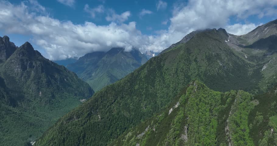 Aerial footage of beautiful high altitude snow capped mountains landscape in sichuan, China
