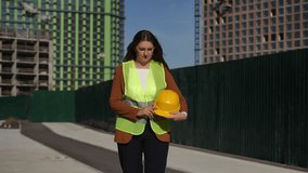 A professional woman in a hard hat and safety vest confidently demonstrates her leadership in construction - Powered by Shutterstock - Get 15% off with code: PIKWIZARD15