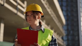 A construction worker performs a safety inspection onsite, ensuring compliance with protocols and promoting safety - Powered by Shutterstock - Get 15% off with code: PIKWIZARD15