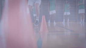 Athlete stepping into cones and shuffling laterally while 3D grid and bargraphs tracking performance. Athlete, training, analytics, biomechanics, performance, sports science, fitness - Powered by Shutterstock - Get 15% off with code: PIKWIZARD15