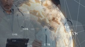Medical team tapping tablet screen and correlating global stats with rotating globe sharing insight. Cardiology, collaboration, innovation, technology, healthcare, data visualization, teamwork - Powered by Shutterstock - Get 15% off with code: PIKWIZARD15