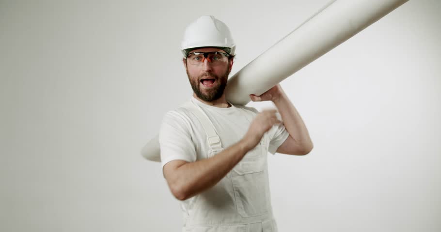 A cheerful builder with blueprints gives a thumbs-up, expressing satisfaction with the construction project. He exudes confidence and expertise, highlighting the smooth progress of the work.