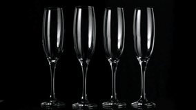 On pause balloons drifting around flutes then champagne pouring into second flute for celebration. Luxury, elegance, celebration, festive, glamour, sophistication, abstract - Powered by Shutterstock - Get 15% off with code: PIKWIZARD15