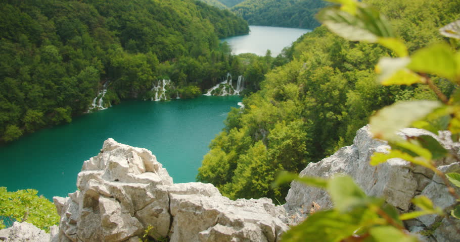 View of vibrant turquoise water and waterfalls at Plitvice Lakes National Park