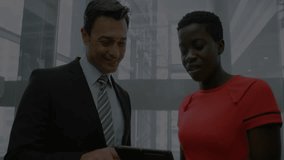 Businessman tapping tablet activating finance overlays as analyst tilting screen to analyze stocks. Technology, data, analytics, corporate, innovation, finance, collaboration - Powered by Shutterstock - Get 15% off with code: PIKWIZARD15