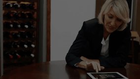 Woman tapping tablet on wooden table and activating grid for analyzing scrolling market trends. Finance, technology, data analytics, businesswoman, digital interface, market trends, professional - Powered by Shutterstock - Get 15% off with code: PIKWIZARD15