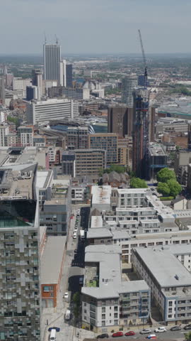 Vertical establishing aerial view of the skyline of Birmingham, city in England, United Kingdom.