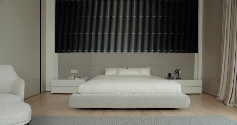 Elegantly designed modern bedroom featuring neutral colors, contemporary furniture, and sophisticated decor. An ideal image for home design themes. Modern Bedroom Interior with Neutral Tones
