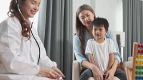 Asian Pediatrician doctor examining child patient with stethoscope, mother comforting son during healthcare examination clinic, professional pediatrician providing family friendly medical care - Powered by Shutterstock - Get 15% off with code: PIKWIZARD15