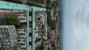 Modern residential buildings in Vimercate, Lombardy, Italy, seen from above with a cloudy sky. Aerial, Vertical Video - Powered by Shutterstock - Get 15% off with code: PIKWIZARD15