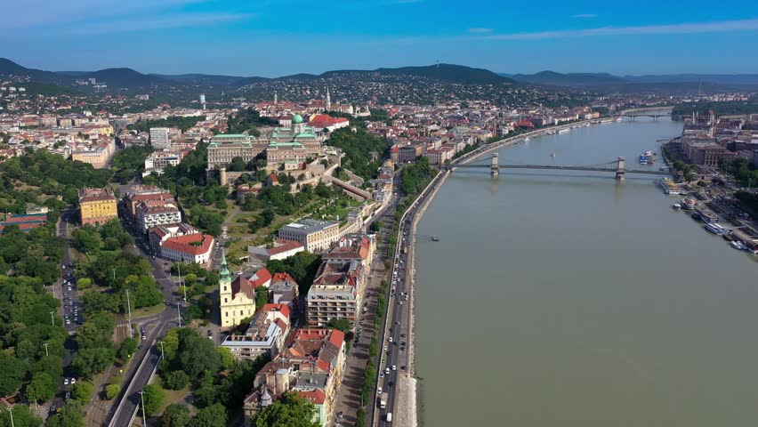 Aerial view of the panorama of Budapest, Hungary - 4K drone footage of Buda Castle, the Royal Palace and the Szechenyi Chain Bridge over the River Danube.