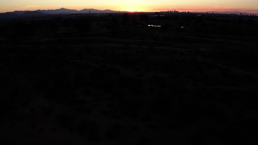Drone shot of the sun setting over Phoenix, Arizona.
