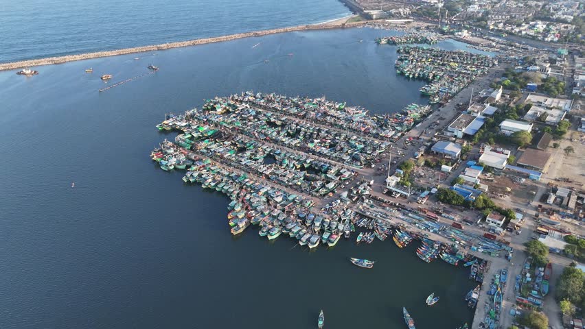 Top-down aerial of Boats in Kasimedu fishing harbor bustling with morning activity