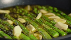 Real authentic cooking in kitchen - aspargus in frying pan - Powered by Shutterstock - Get 15% off with code: PIKWIZARD15
