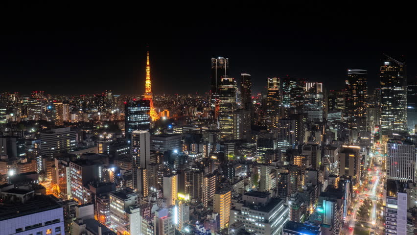 tokyo city downtown skyline aerial view time lapse night to day,pan timelapse of sun rising over high-rise business buildings skyscrapers of modern town