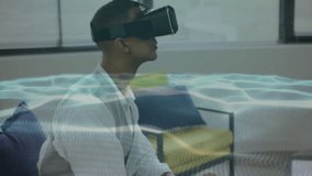 Man wearing VR headset pointing and selecting rotating interface waves for data recovery in lounge. Virtual reality, digital interface, futuristic technology, innovation, user interaction, modern - Powered by Shutterstock - Get 15% off with code: PIKWIZARD15