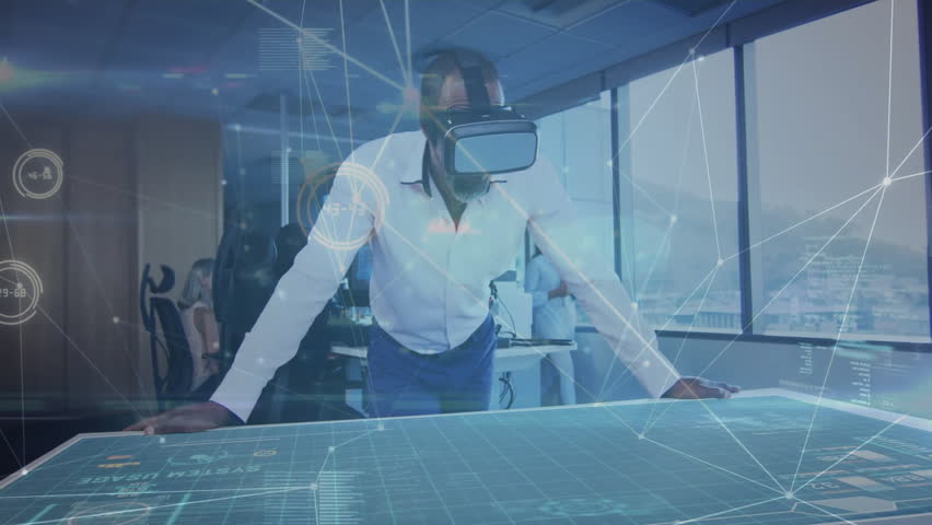Senior man using VR headset on table, activating aircraft model for demo while colleague watching. Technology, innovation, holography, collaboration, urban, futurism, data visualization - Powered by Shutterstock - Get 15% off with code: PIKWIZARD15
