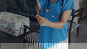 Nurse entering view with radiographic film, rotating for diagnosis while digital graphs overlay. Medical, healthcare, diagnostic, clinical, professional, modern, patient - Powered by Shutterstock - Get 15% off with code: PIKWIZARD15