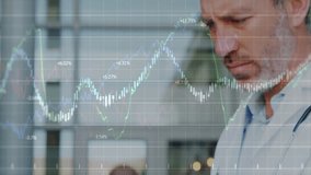 male doctor tapping tablet in clinic causing animated graphs showing patient data trends for review. Medical, technology, analytics, healthcare, professional, futurism, digital - Powered by Shutterstock - Get 15% off with code: PIKWIZARD15