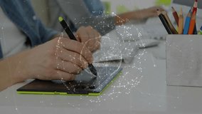 Designer's hand with green stylus nearing tablet forming rotating network globe mapping data. Technology, innovation, creativity, digital art, futuristic, workspace, collaboration - Powered by Shutterstock - Get 15% off with code: PIKWIZARD15