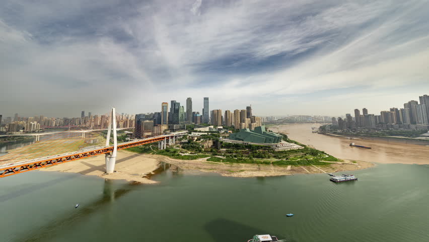 CHONGQING, CHINA - 28 MAY 2025 : Timelapse of the amazing Chongqing cyberpunk city skyline from a high vantage point with the yangtze river