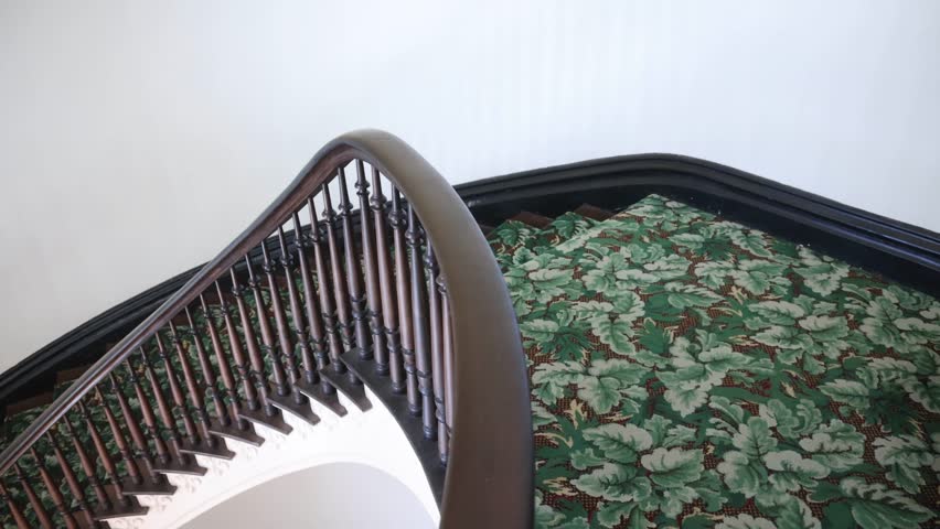 Historic spiral staircase inside the Alabama state capitol with video panning right to left.