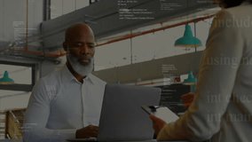 Project manager showing overlaid code on tablet and engineer typing on laptop in software review. Collaboration, technology, modern, corporate, innovation, teamwork, digital - Powered by Shutterstock - Get 15% off with code: PIKWIZARD15