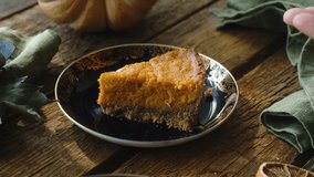 Sprinkle slice of pumpkin pie with chopped almonds. Making homemade traditional American thanksgiving pie - Powered by Shutterstock - Get 15% off with code: PIKWIZARD15