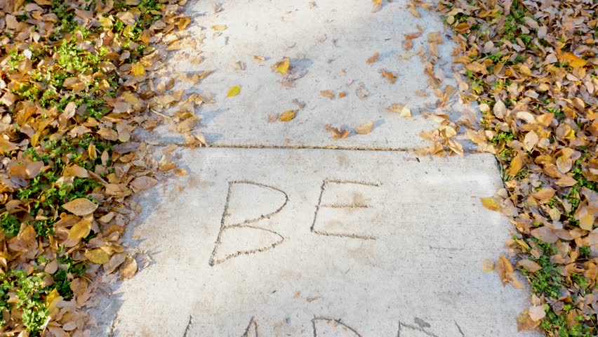 Be happy message on concrete
