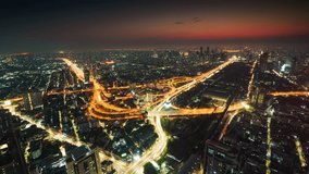 Timelapse aerial view of futuristic Bangkok city with skyscraper building and illuminated expressway during dawn in business district at central of Thailand - Powered by Shutterstock - Get 15% off with code: PIKWIZARD15