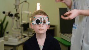 Child patient undergoing eyesight examination with trial frame by optometrist - Powered by Shutterstock - Get 15% off with code: PIKWIZARD15