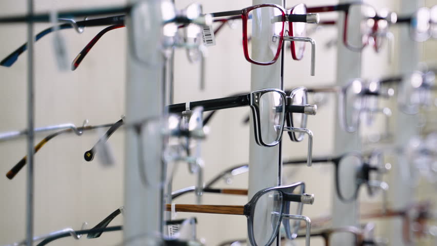 Eyeglasses display stand showing various modern eyeglass frames