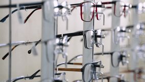 Eyeglasses display stand showing various modern eyeglass frames - Powered by Shutterstock - Get 15% off with code: PIKWIZARD15