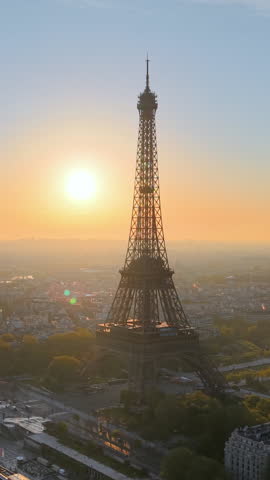 Experience Stunning Aerial Views of the Majestic Eiffel Tower in the Heart of Paris. Vertical video