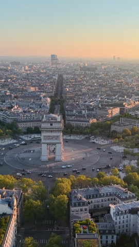 Experience the Stunning Aerial View of Paris with the Iconic Arc de Triomphe at Sunrise. Vertical video