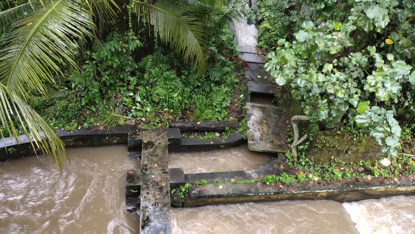 A small dam that functions as a divider of river water towards agricultural areas ensures that all areas along the river get their fair share.
