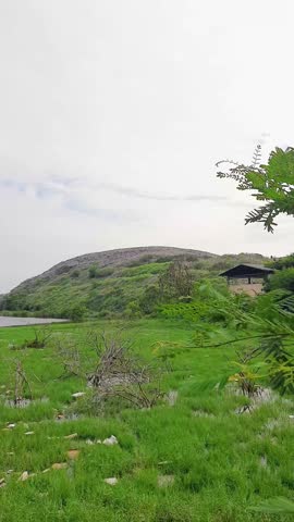 View of a hill of rubbish seen from a distance, an overloaded landfill in Slamaran Pekalongan, Central Java	