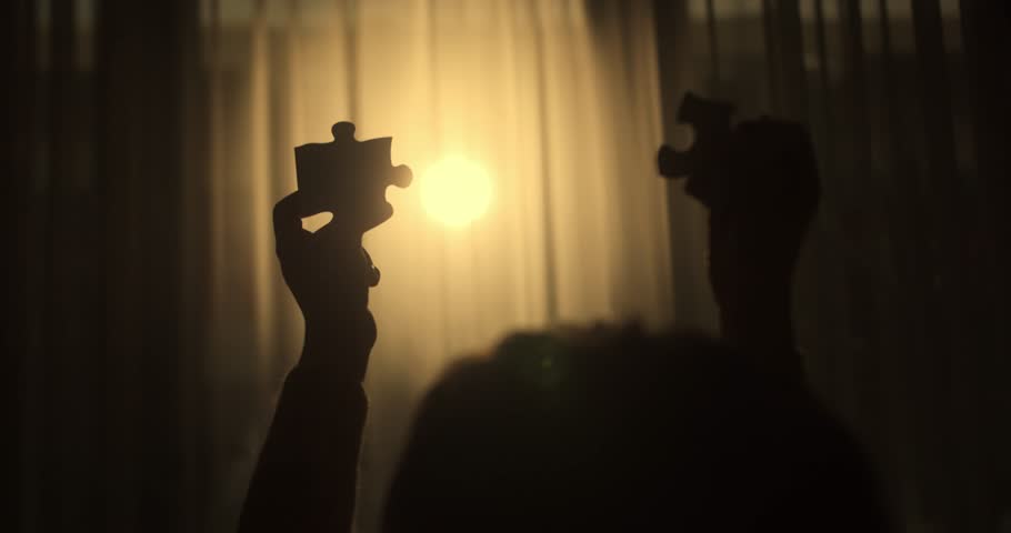 Close Up Hands of Woman Connecting Jigsaw Puzzle With Sunlight Affect. Business Solutions, Success Strategy. Two Hands Connect Couple Puzzle. One Part of Whole Symbol of Association and Connection.