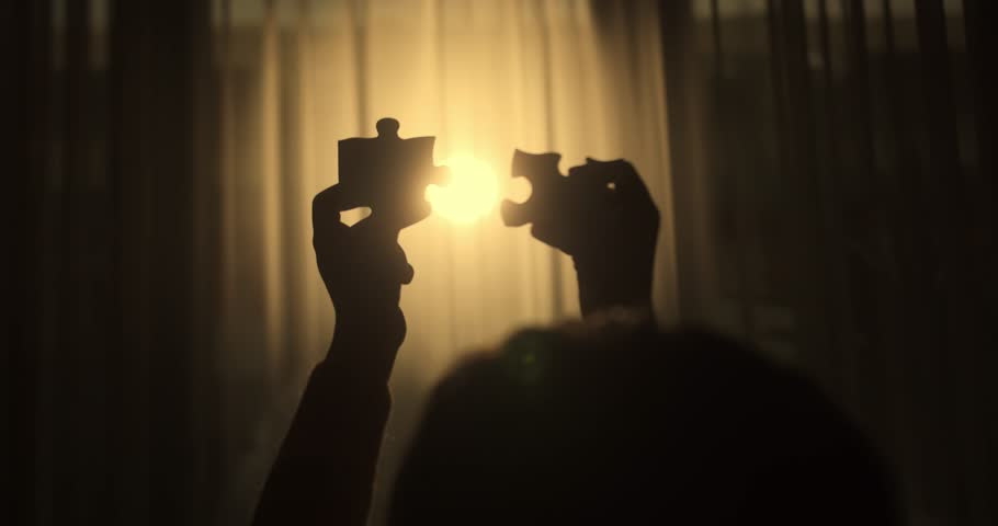 Close Up Hands of Woman Connecting Jigsaw Puzzle With Sunlight Affect. Business Solutions, Success Strategy. Two Hands Connect Couple Puzzle. One Part of Whole Symbol of Association and Connection.