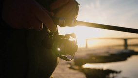 Tranquil winter morning sunlight backlighting solitary fisherman casting fishing line into icy river near snow-covered bridge at golden hour sunrise - Powered by Shutterstock - Get 15% off with code: PIKWIZARD15