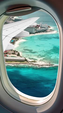 Panoramic aerial view of the famous Cancun Quintana Roo city, on the Yucatan Peninsula, Mexico. general panoramic view of the hotel zone in Cancun seen through the window of the plane.Vertical upright