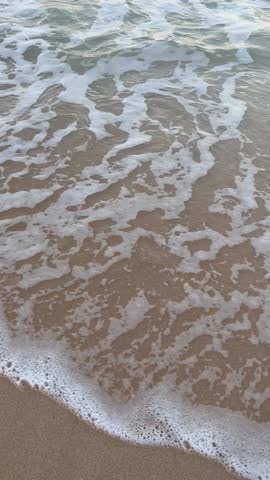 waves crashing on the beach in Honolulu, Hawaii
