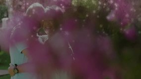 Pink blossoms and snow fading, camera focusing senior couple embracing in yard promoting health. Romance, affection, nature, serenity, companionship, outdoor, vitality - Powered by Shutterstock - Get 15% off with code: PIKWIZARD15