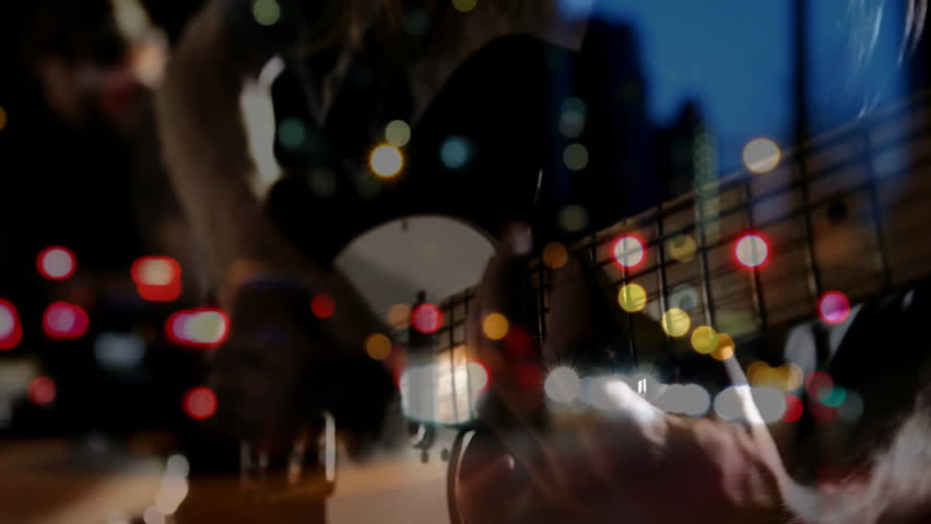 Guitarist plucking strings and initiating bokeh lights while drummer matching beats for music set. Musicians, performance, stage, acoustic, harmony, entertainment, vibrant