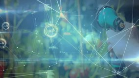 Hand pressing green hose nozzle watering tomato plants as digital overlay tracking irrigation data. Gardening, technology, smart agriculture, innovation, data visualization, horticulture, - Powered by Shutterstock - Get 15% off with code: PIKWIZARD15