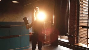 Woman fighter with boxing gloves standing on boxing ring celebrating victory. Woman boxing champion showing raising hands up. Strong powerful girl on boxing ring arena. Competition champion winner - Powered by Shutterstock - Get 15% off with code: PIKWIZARD15