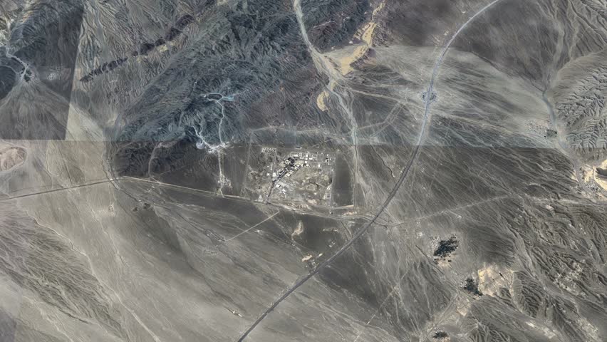 Aerial Shot from Natanz, Iranian province. A breathtaking view of a vibrant rainbow arching over a rolling hill in Natanz. Mountain range in Iran near city of Natanz