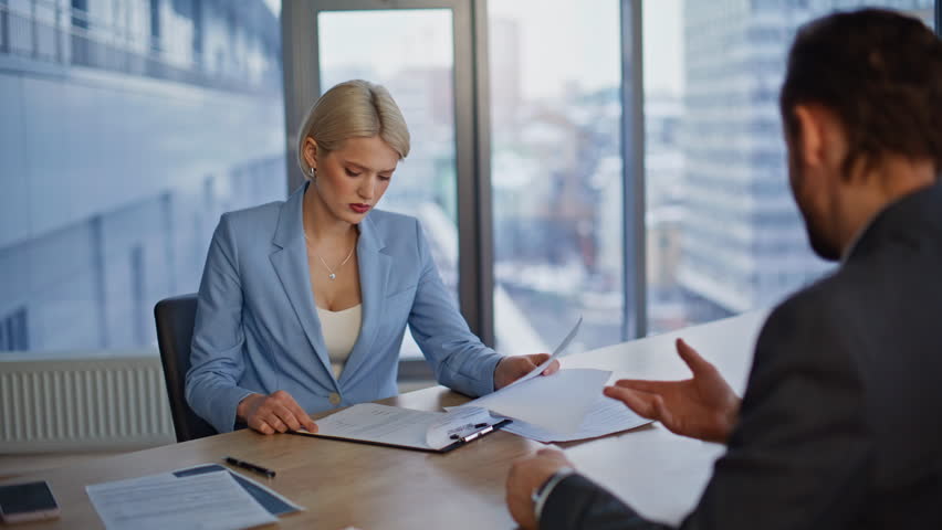 Startup founder finalizing agreement with investor greeting firmly at workplace closeup. Smiling executive approving document satisfied cooperation with associate. Teammates organizing collaboration